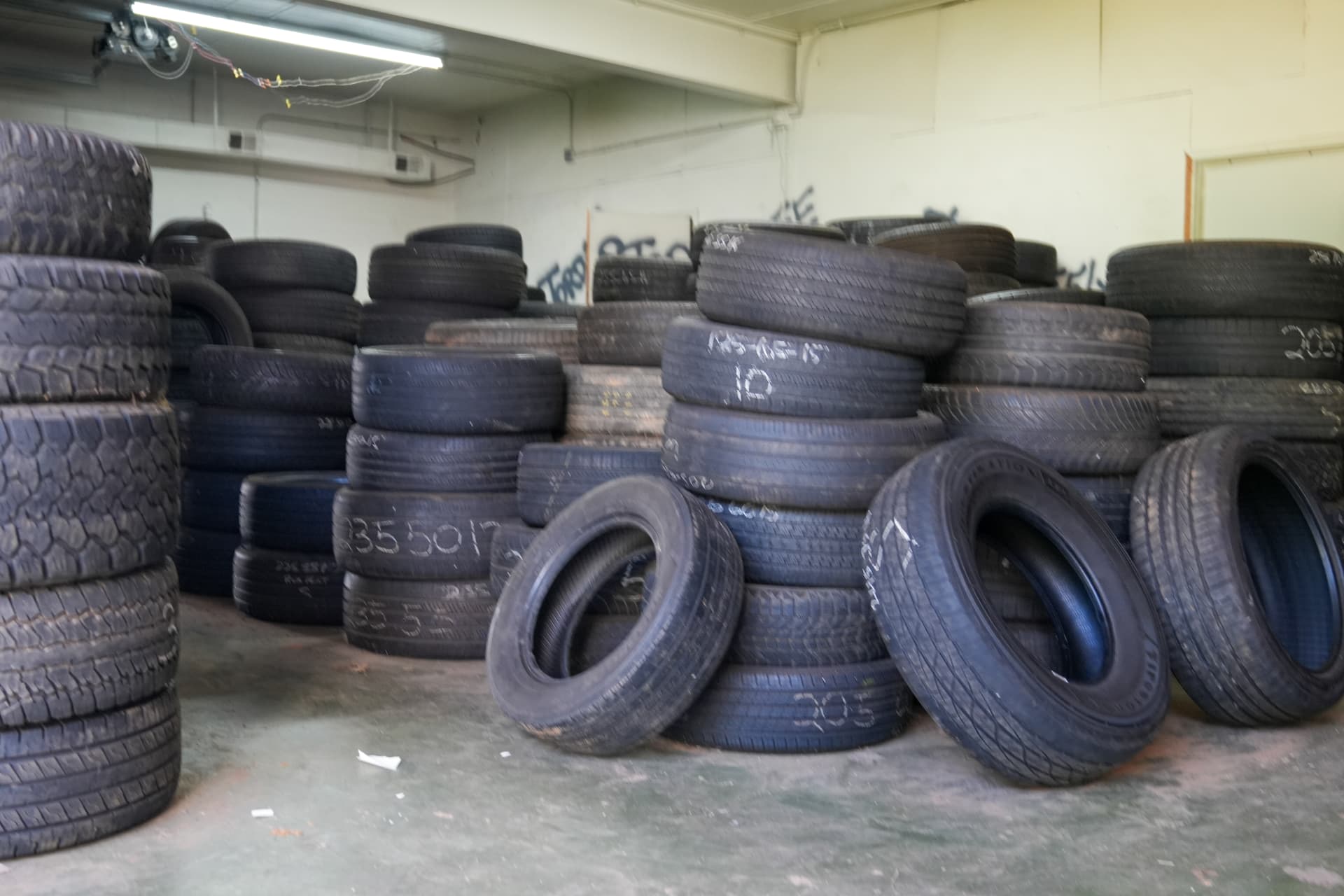 Used tire storage room filled with sorted tires