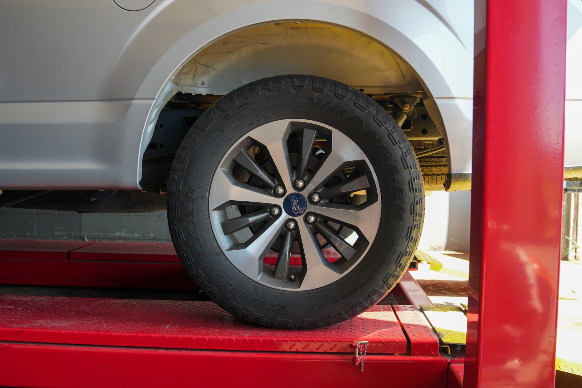 Close-up of a truck wheel and tire on the alignment rack